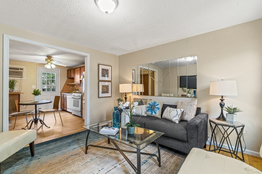 23 Heard Street, Unit 23 Chelsea, MA 02150 - Photo 5 of 27 a living room with furniture and wooden floor