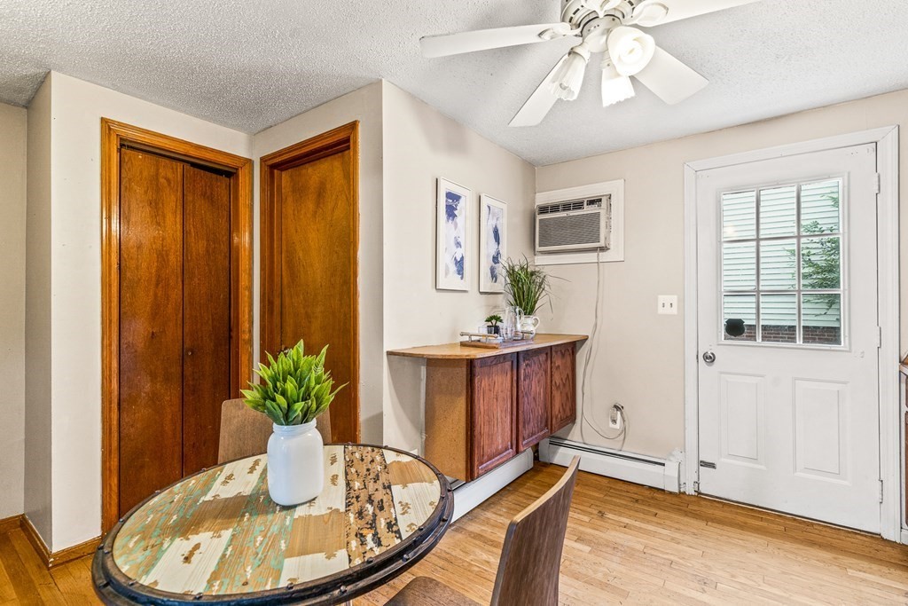 23 Heard Street, Unit 23 Chelsea, MA 02150 - Photo 7 of 27 a view of a dining room with furniture window and wooden floor