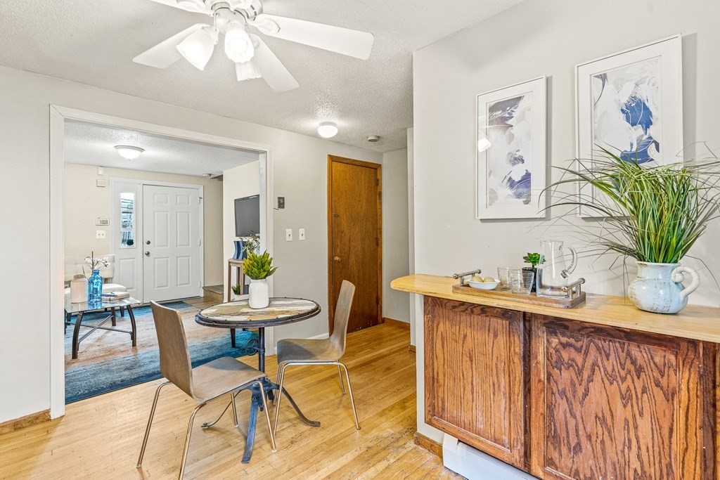 23 Heard Street, Unit 23 Chelsea, MA 02150 - Photo 10 of 27 a view of a dining room with furniture and wooden floor