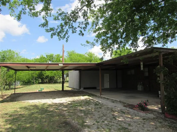 a view of backyard with green space