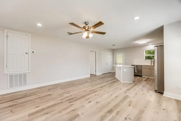 a view of a kitchen with a sink and a window