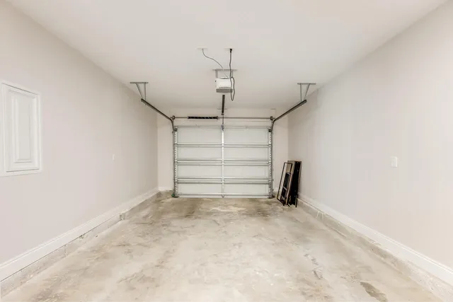 a view of a room with a white walls