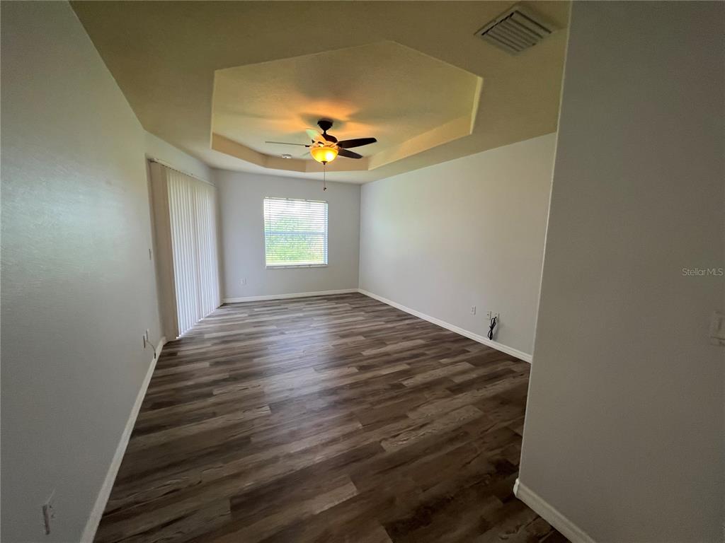 99 Flanders Street Port Charlotte, FL 33954 - Photo 21 of 29 a view of room with a ceiling fan and window