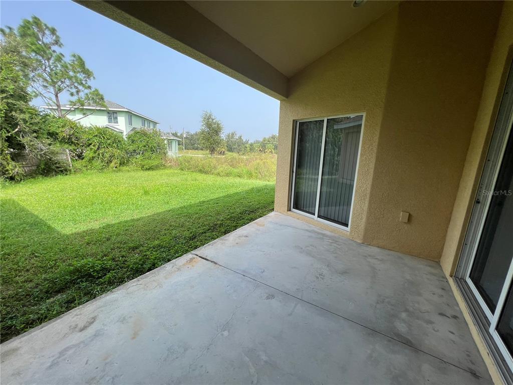 99 Flanders Street Port Charlotte, FL 33954 - Photo 26 of 29 a view of outdoor space and yard