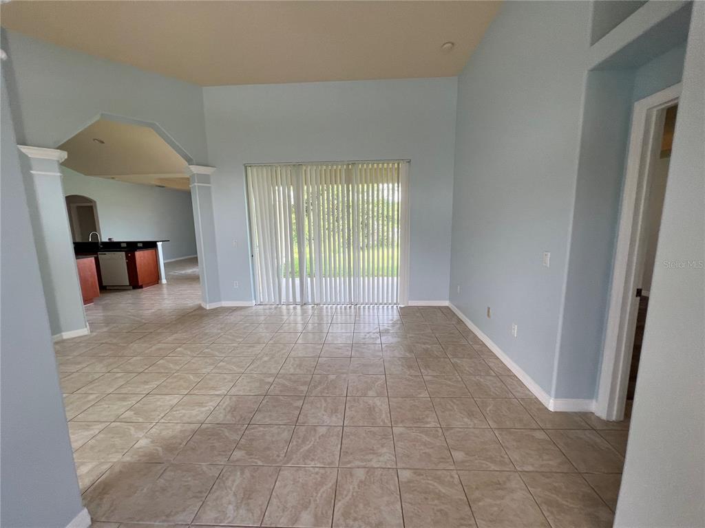 99 Flanders Street Port Charlotte, FL 33954 - Photo 4 of 29 a view of an empty room with a window