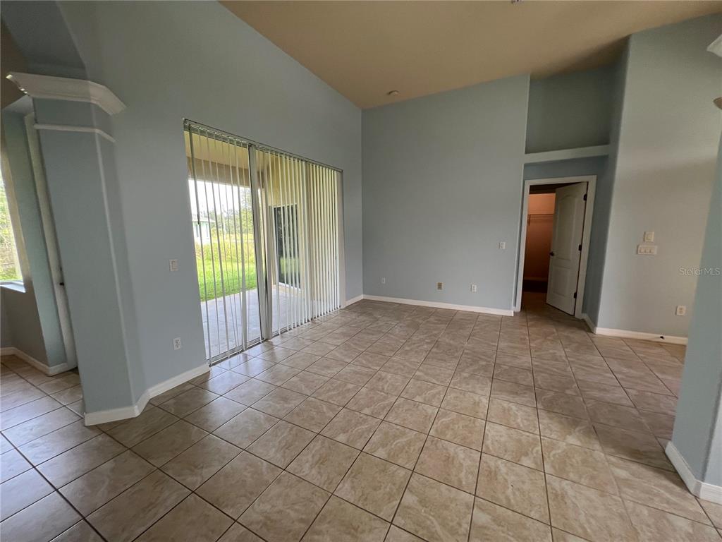 99 Flanders Street Port Charlotte, FL 33954 - Photo 6 of 29 a view of an empty room and window