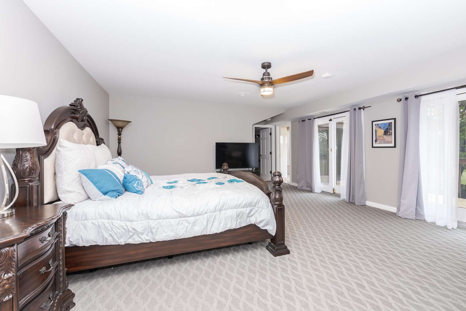 1810 Cardinal Court Pontiac, IL 61764 - Photo 50 of 88 a bedroom with a large bed and a chandelier
