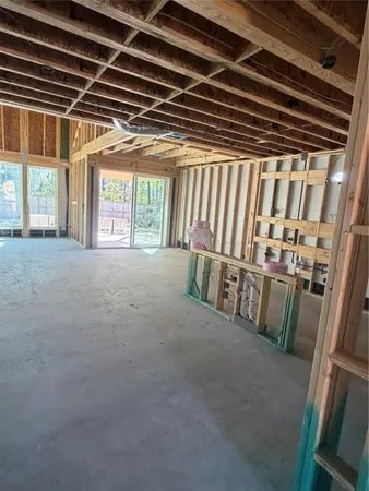 a view of an empty room with windows