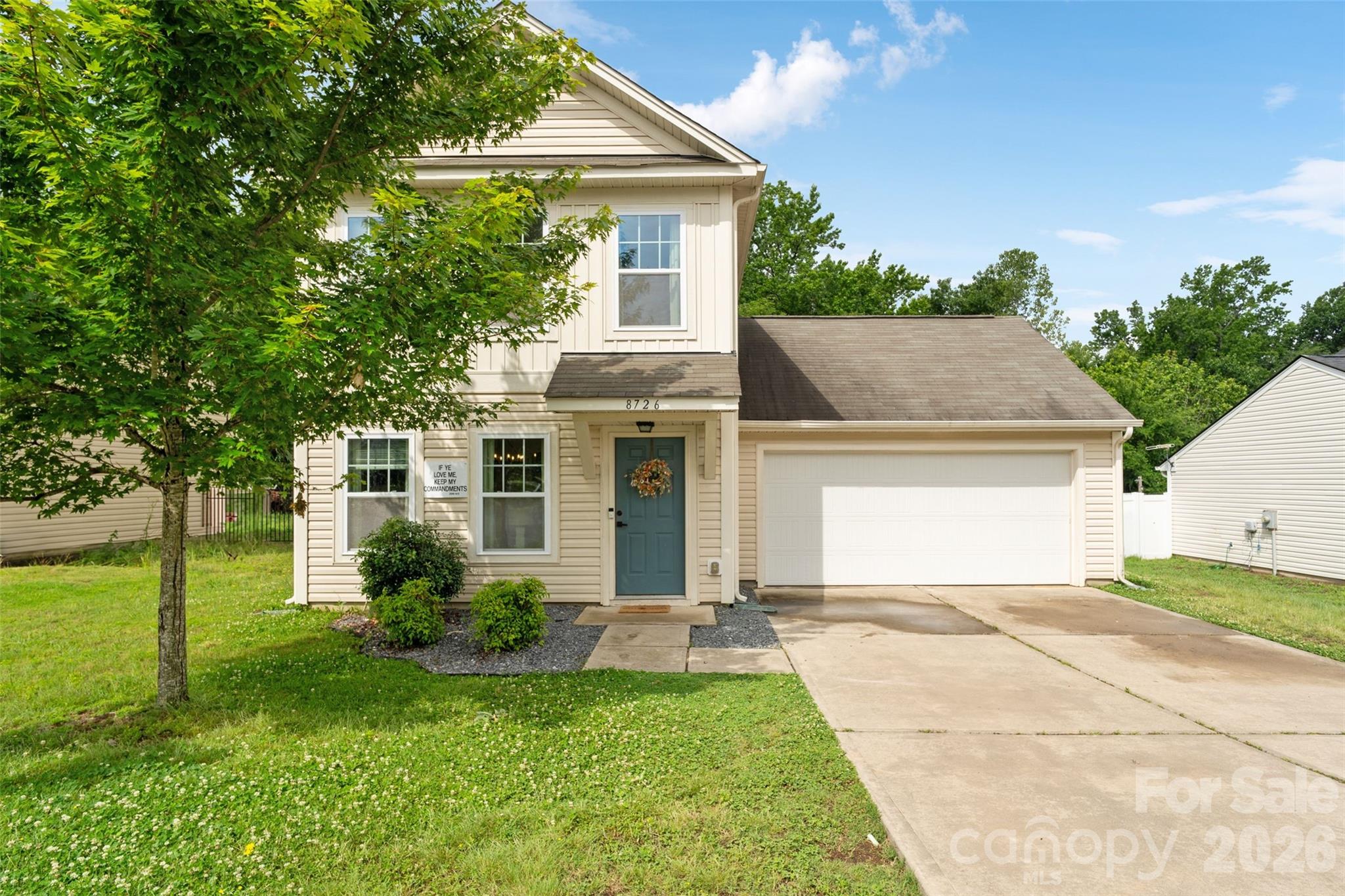 8726 Conrad Street Locust, NC 28097 - Photo 27 of 36 a front view of a house with a yard and garage