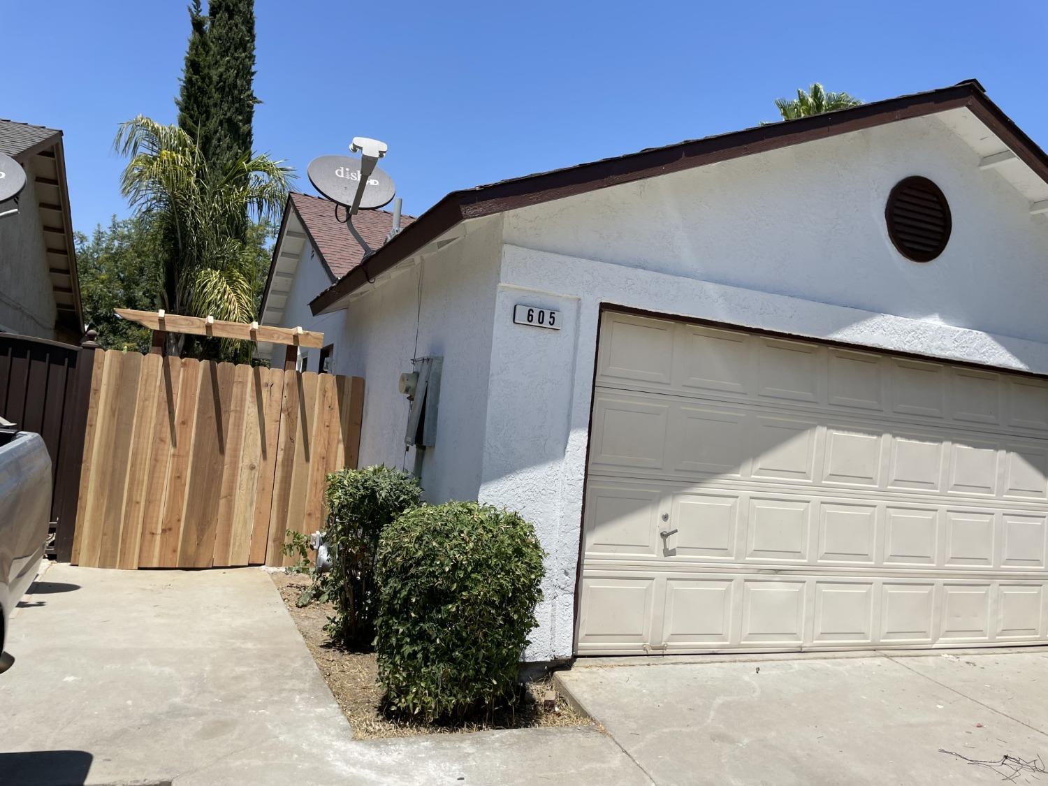 605 El Monte Street Madera, CA 93637 - Photo 14 of 17 a view of a house with a outdoor space
