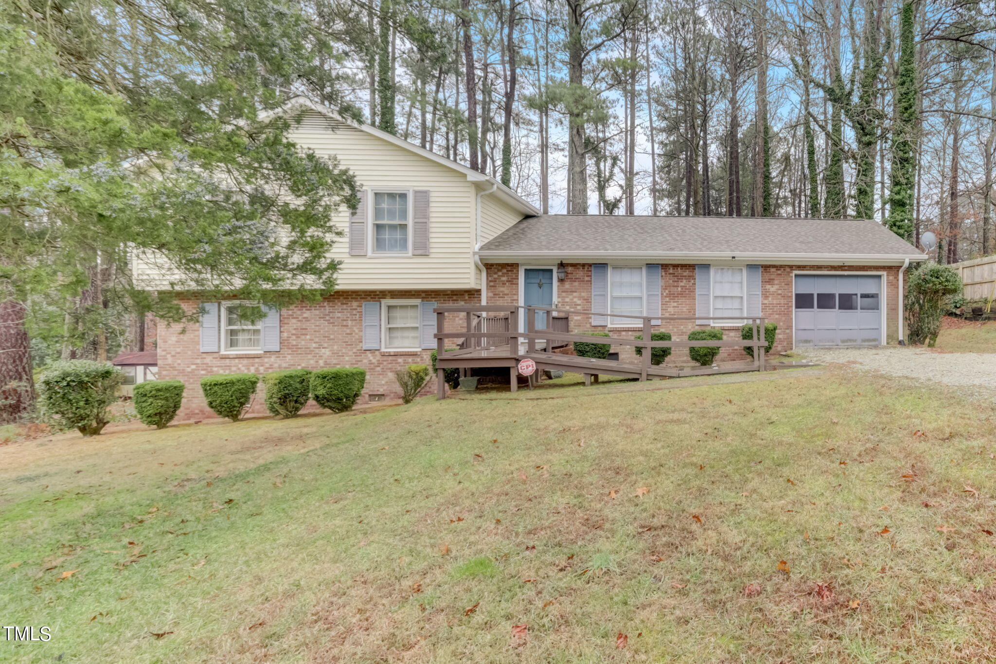5502 Russell Road Durham, NC 27712 - Photo 1 of 31 a front view of a house with garden