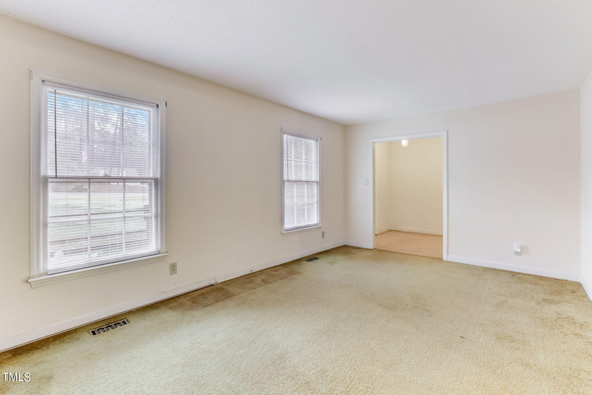 5502 Russell Road Durham, NC 27712 - Photo 11 of 31 an empty room with windows