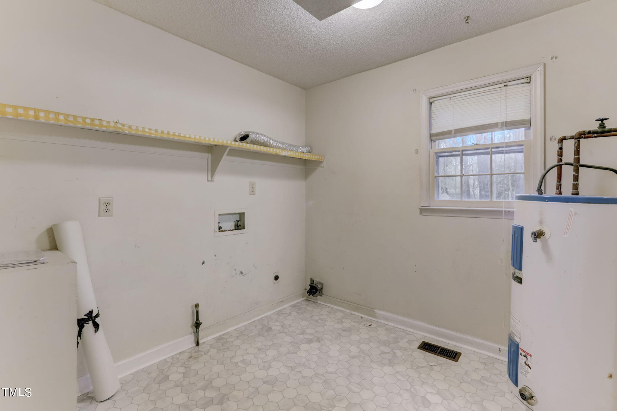 5502 Russell Road Durham, NC 27712 - Photo 27 of 31 a view of a room that has a fan and a window