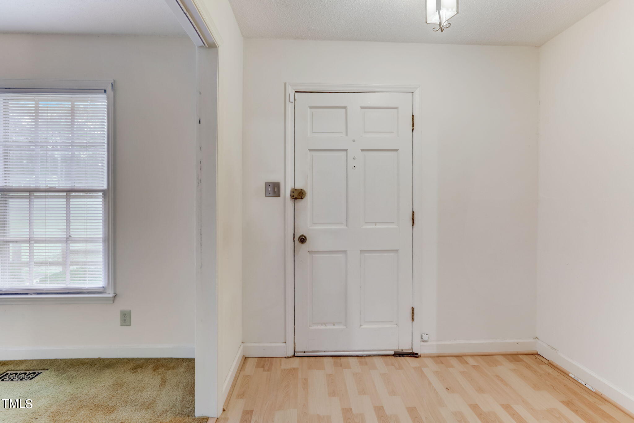 5502 Russell Road Durham, NC 27712 - Photo 9 of 31 an empty room with wooden floor and closet