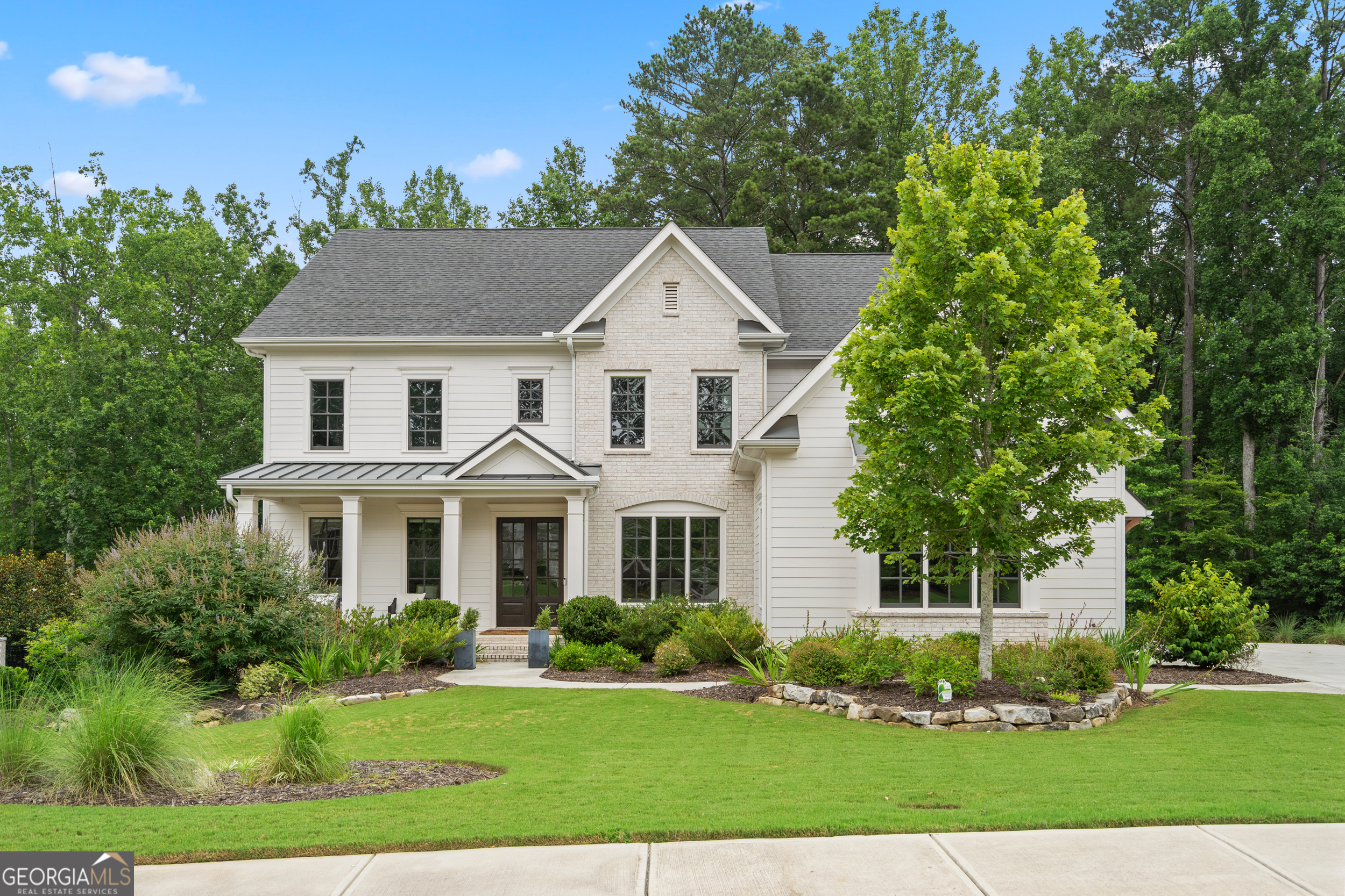 2045 Kent Court Milton, GA 30004 - Photo 1 of 104 a front view of a house with a yard