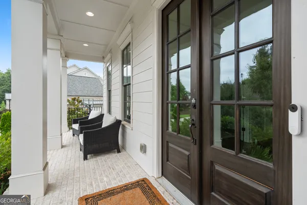 a view of an entryway with wooden floor
