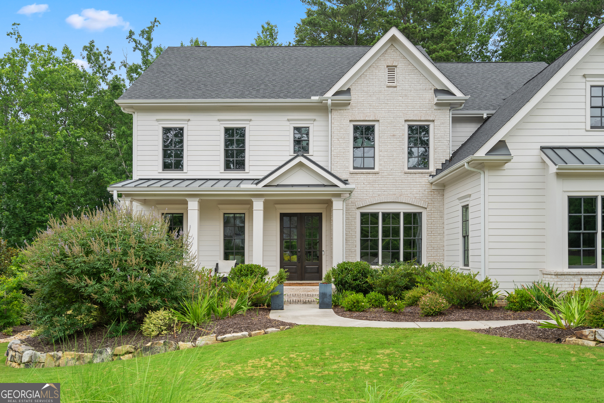 2045 Kent Court Milton, GA 30004 - Photo 13 of 104 a front view of a house with a yard