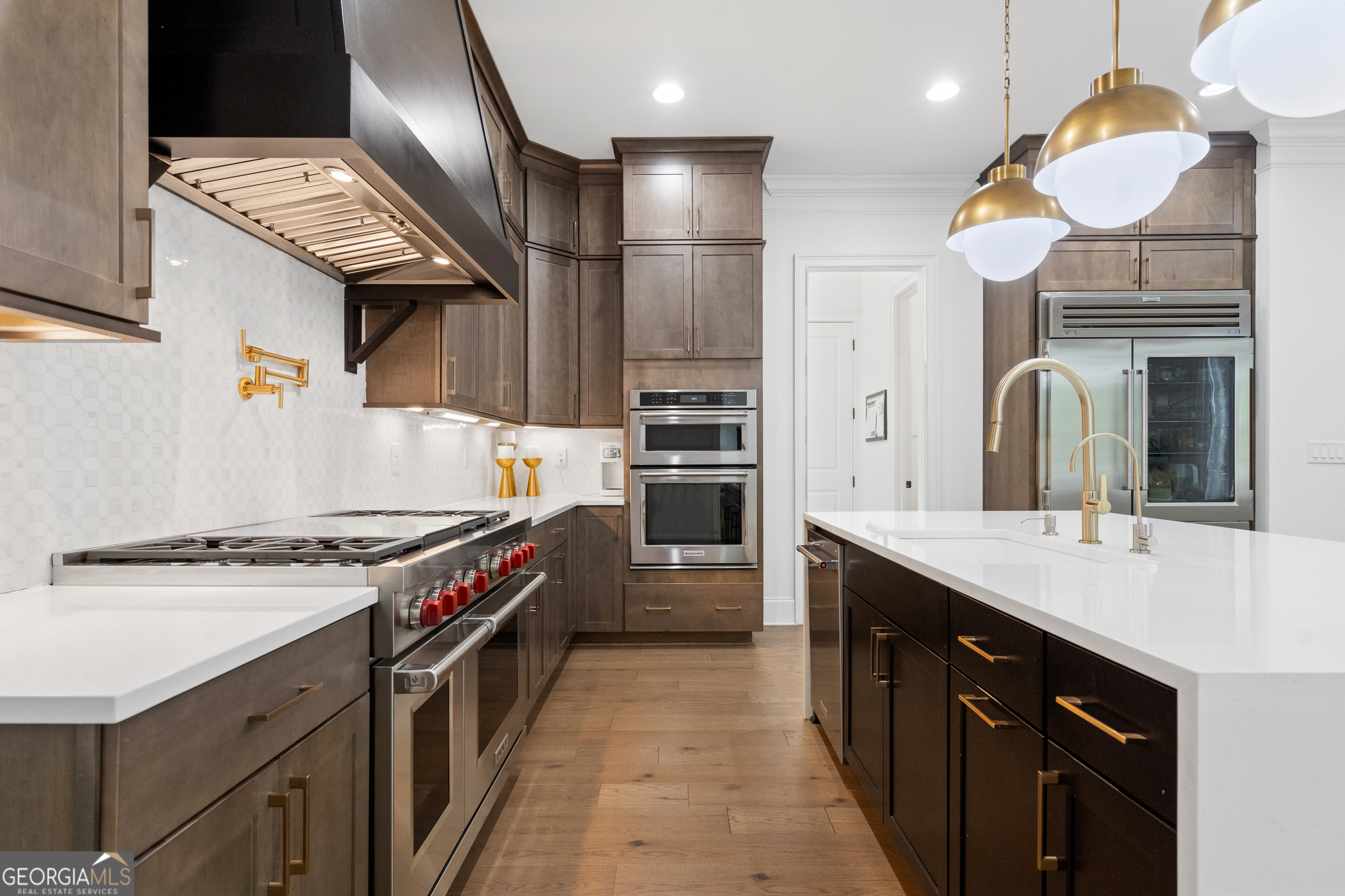 2045 Kent Court Milton, GA 30004 - Photo 22 of 104 a kitchen with stainless steel appliances granite countertop a stove a sink and a refrigerator