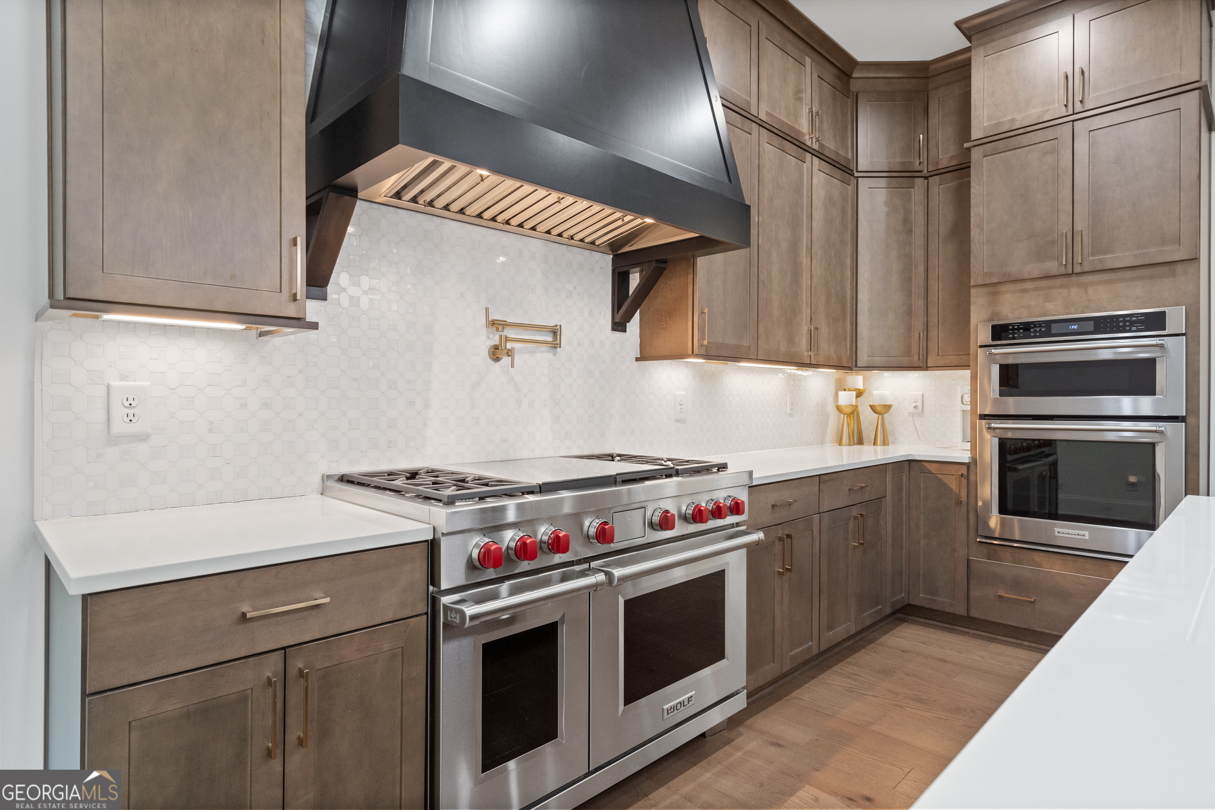 2045 Kent Court Milton, GA 30004 - Photo 23 of 104 a kitchen with stainless steel appliances granite countertop a stove and a refrigerator