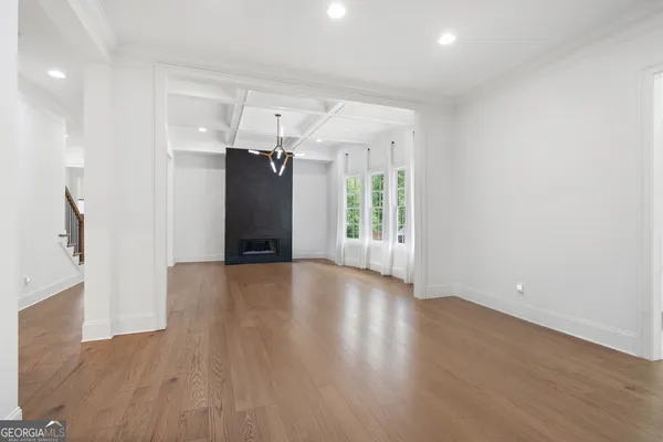 a spacious bathroom with a double vanity sink a mirror and a bathtub