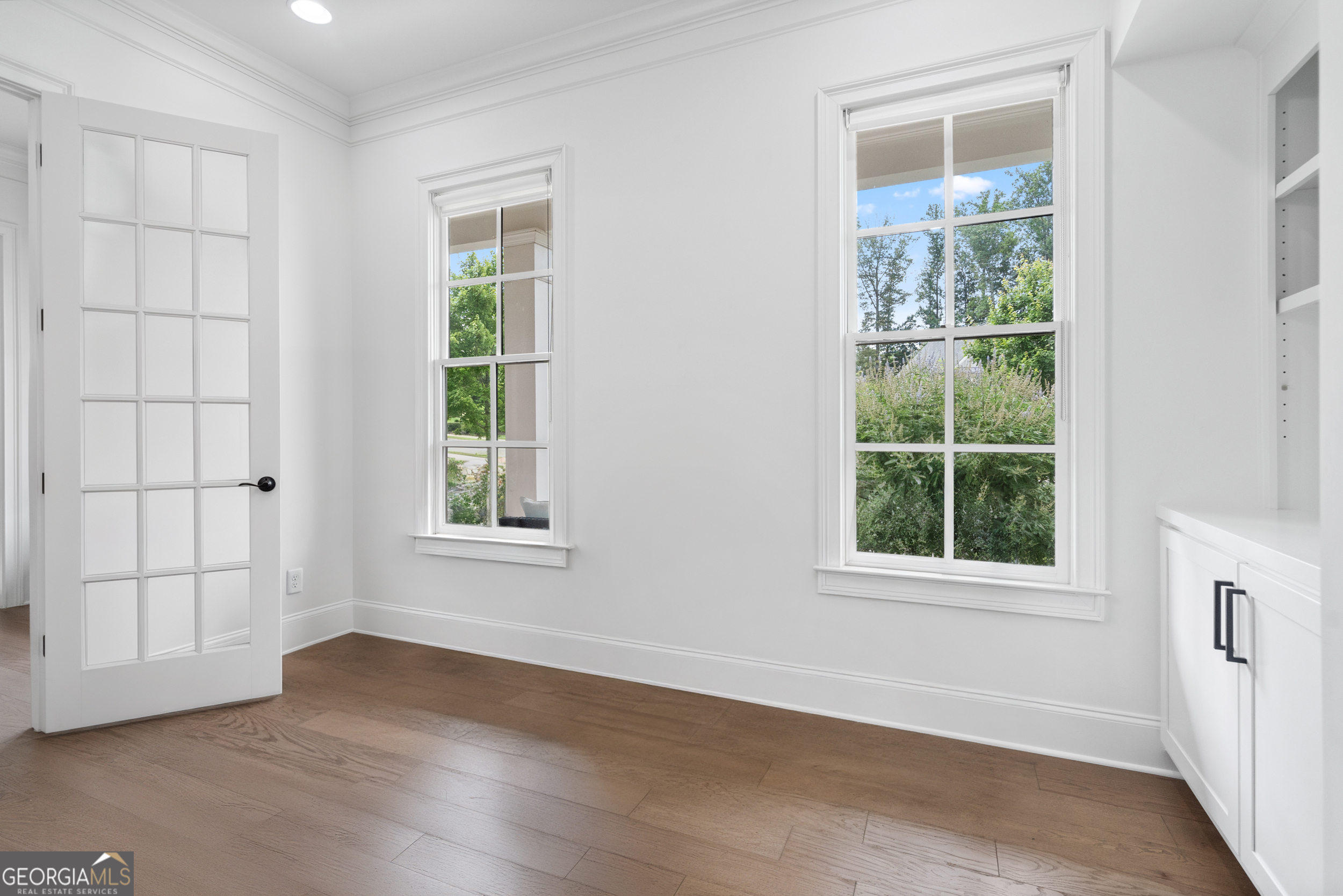 2045 Kent Court Milton, GA 30004 - Photo 34 of 104 an empty room with wooden floor and windows