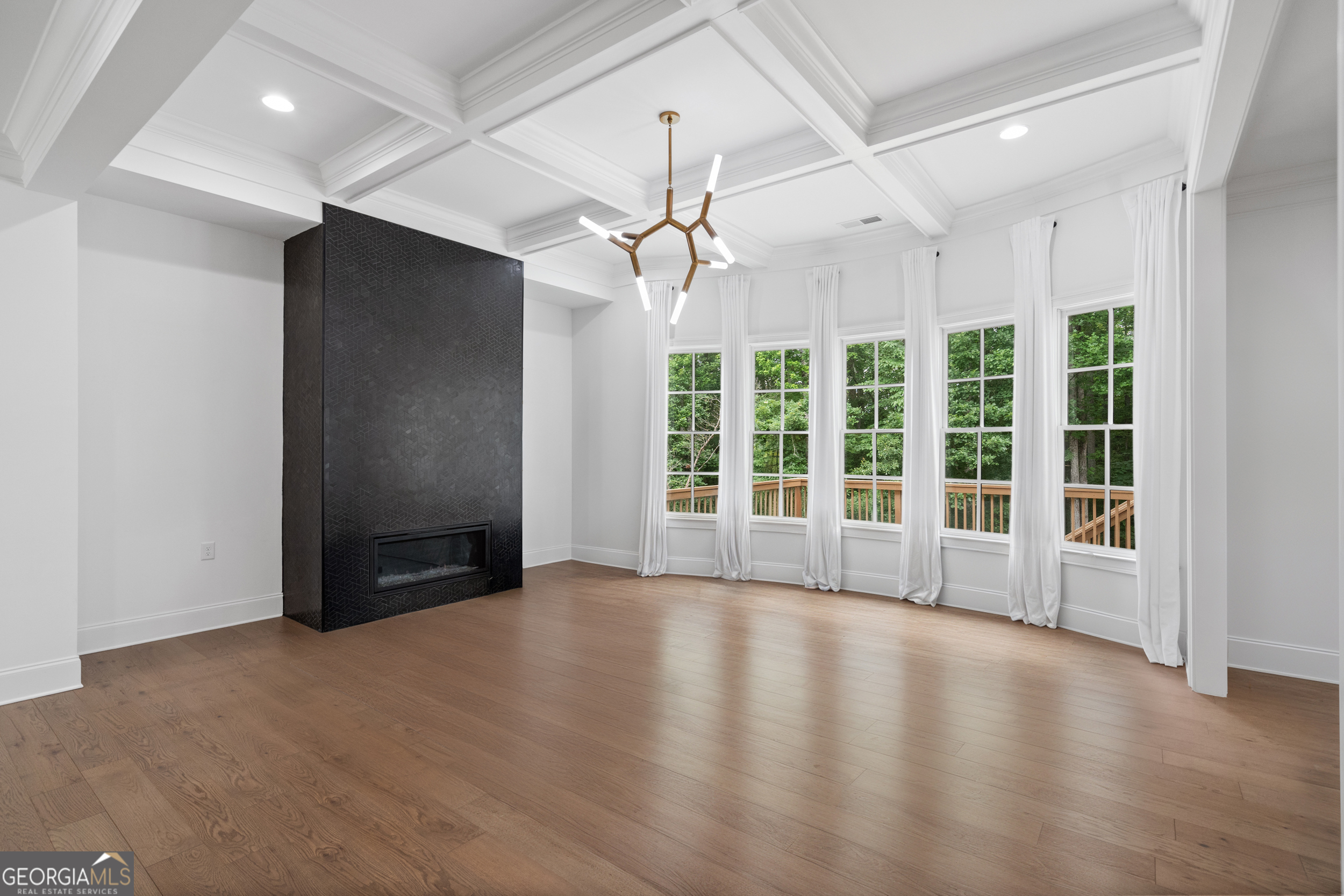 2045 Kent Court Milton, GA 30004 - Photo 35 of 104 a view of an empty room with a window and wooden floor