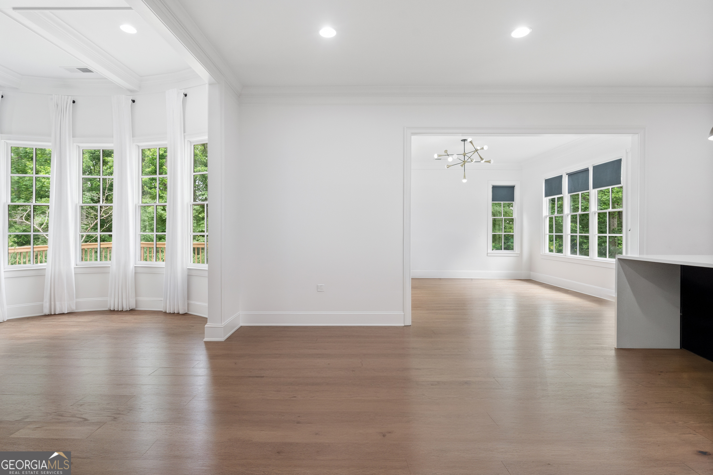2045 Kent Court Milton, GA 30004 - Photo 39 of 104 an empty room with wooden floor and windows