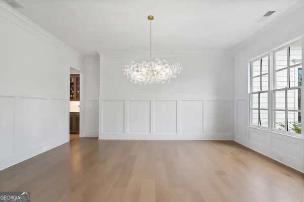 a view of an empty room with a staircase