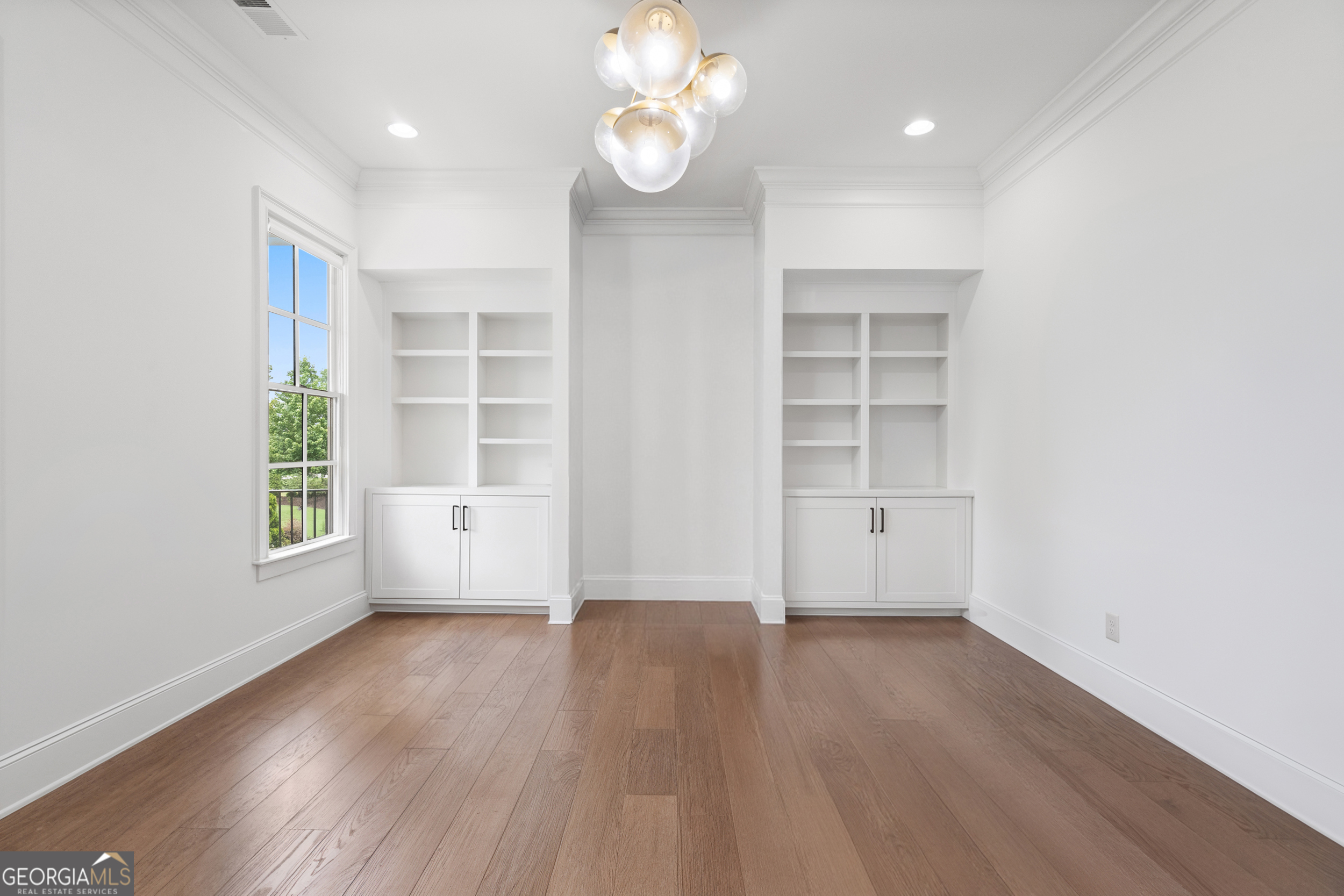 2045 Kent Court Milton, GA 30004 - Photo 46 of 104 an empty room with wooden floor and windows