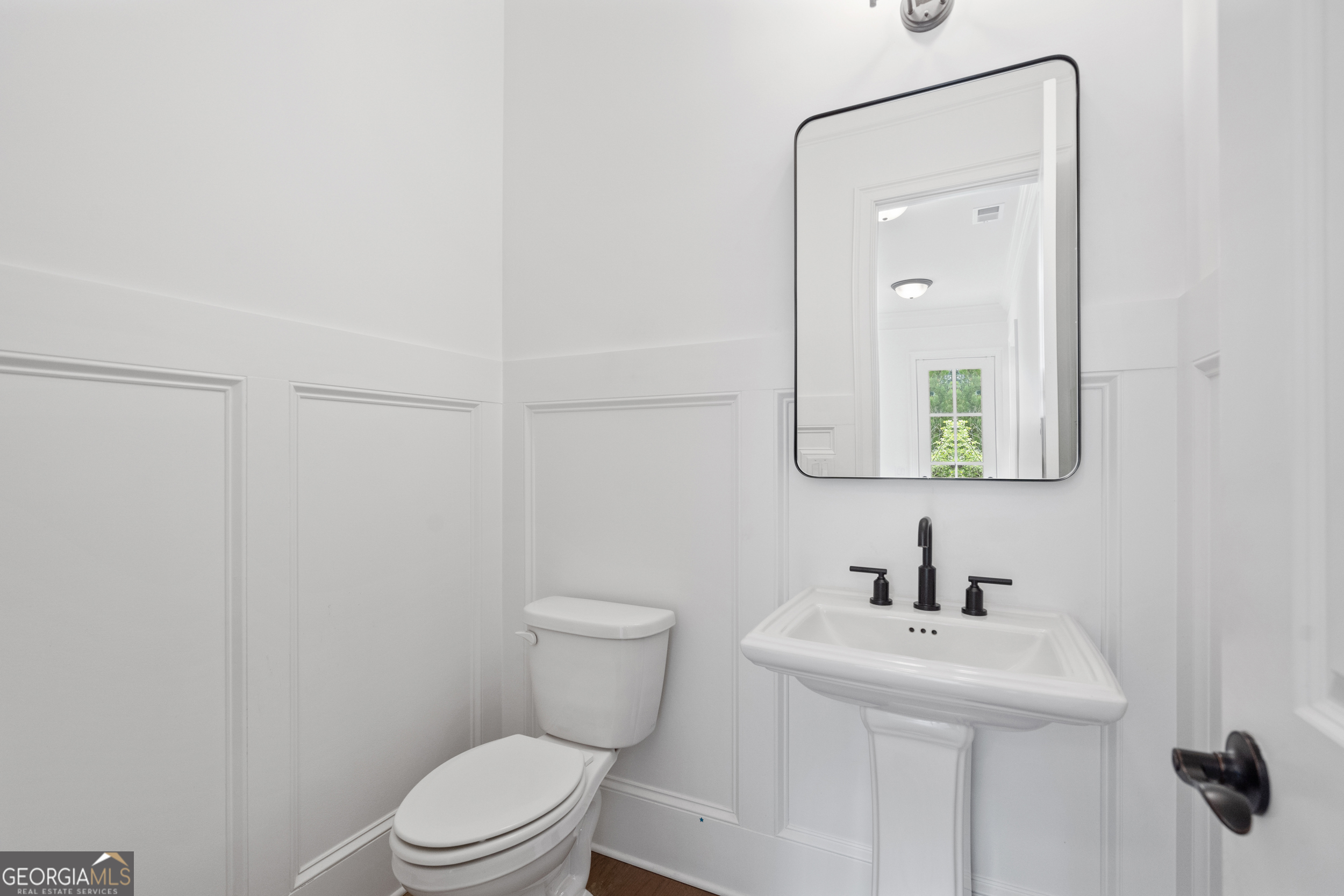 2045 Kent Court Milton, GA 30004 - Photo 47 of 104 a bathroom with a toilet a sink and mirror