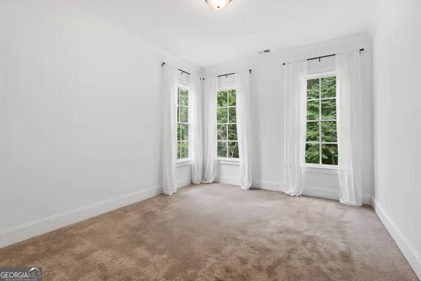an aerial view of a house with a garden