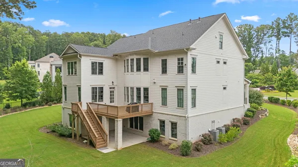 an aerial view of a house with garden space and street view