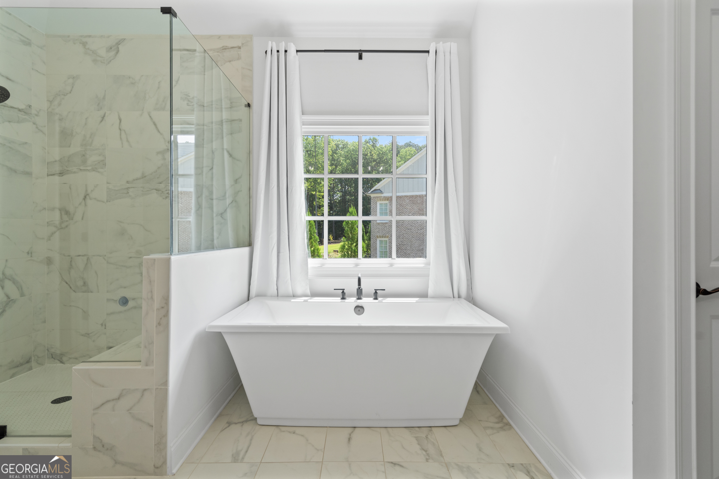 2045 Kent Court Milton, GA 30004 - Photo 55 of 104 a white bath tub sitting next to a window