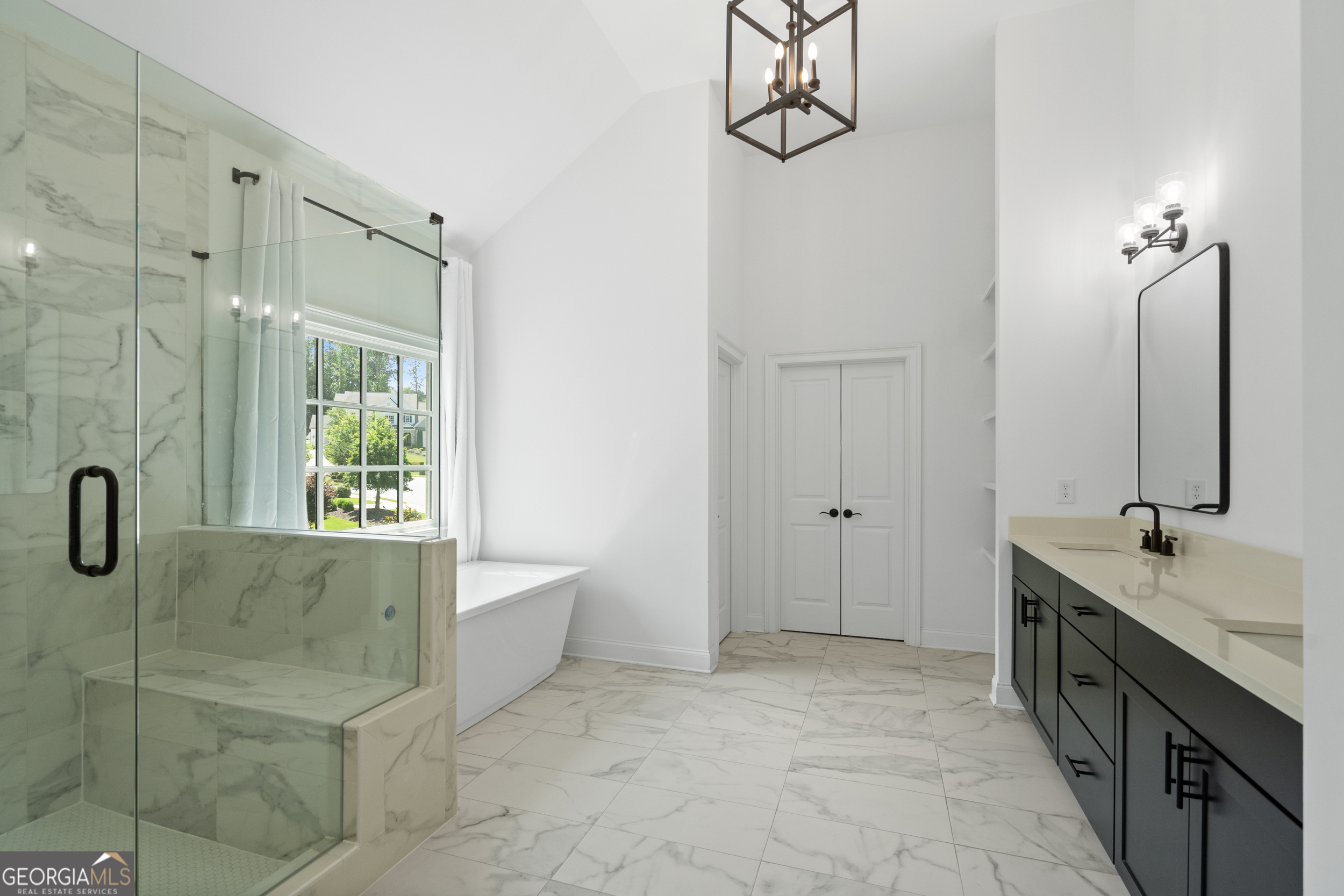 2045 Kent Court Milton, GA 30004 - Photo 57 of 104 a spacious bathroom with a double vanity sink a mirror and a bathtub