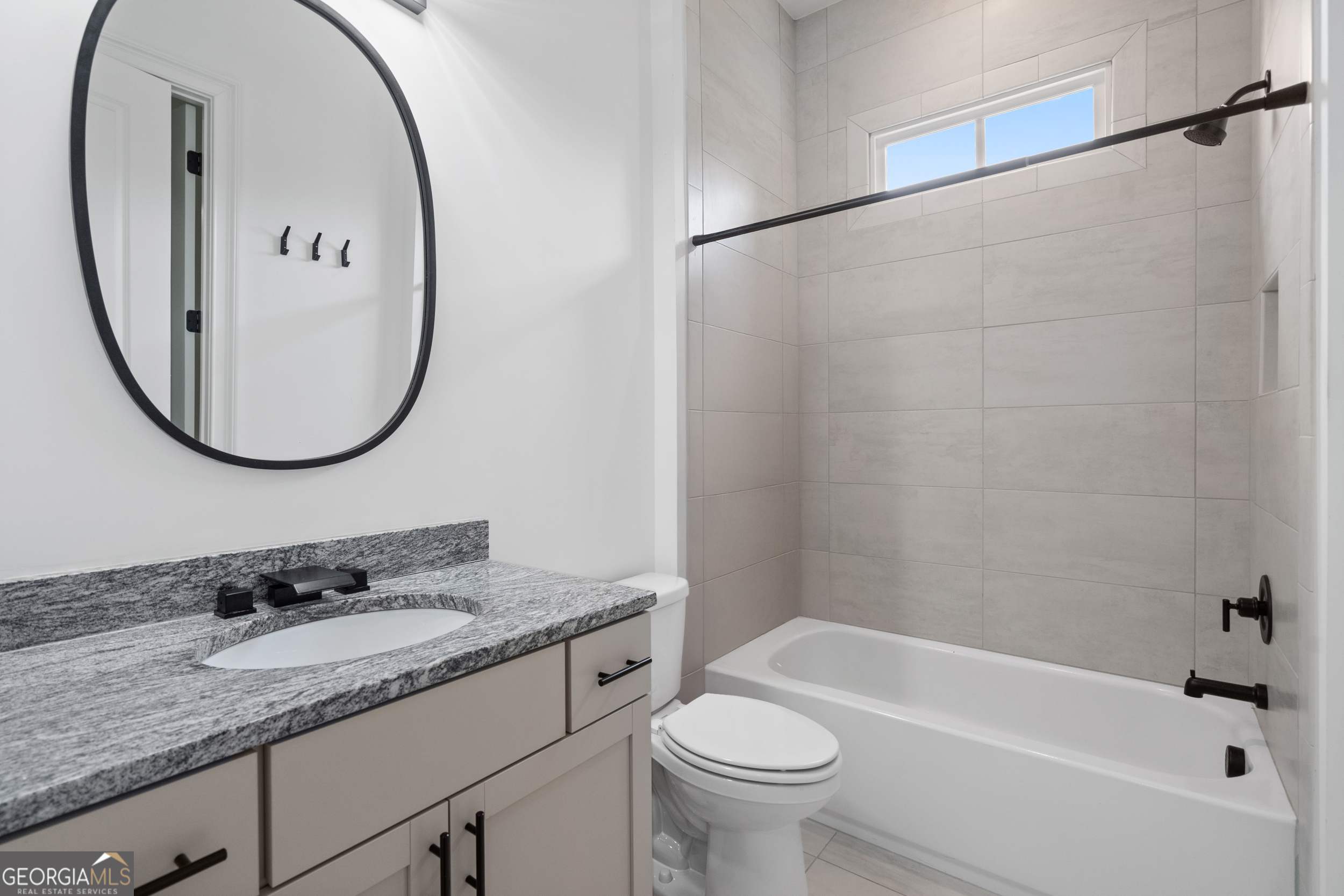 2045 Kent Court Milton, GA 30004 - Photo 63 of 104 a bathroom with a granite countertop sink mirror toilet and bathtub