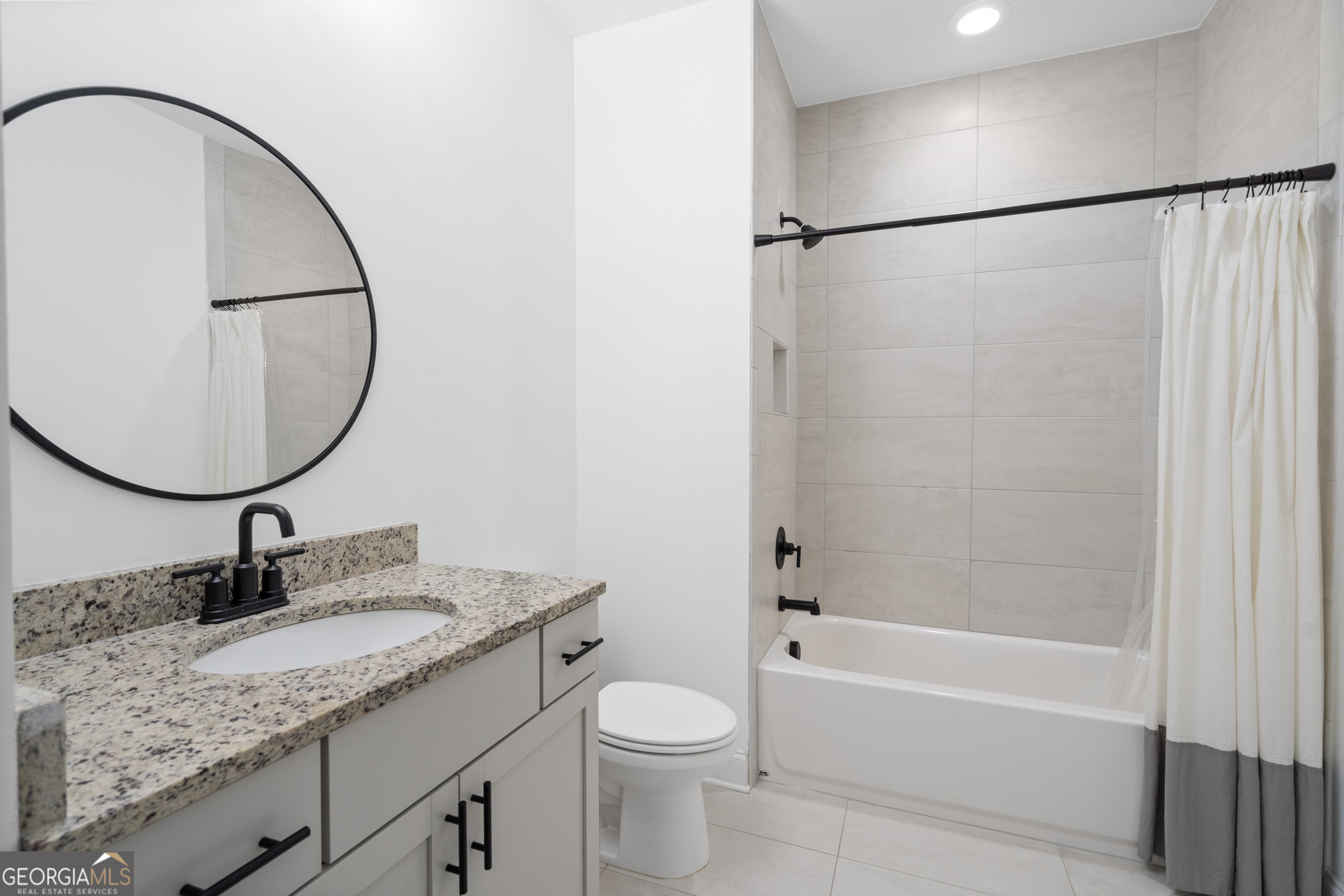 2045 Kent Court Milton, GA 30004 - Photo 64 of 104 a bathroom with a granite countertop sink toilet and a mirror
