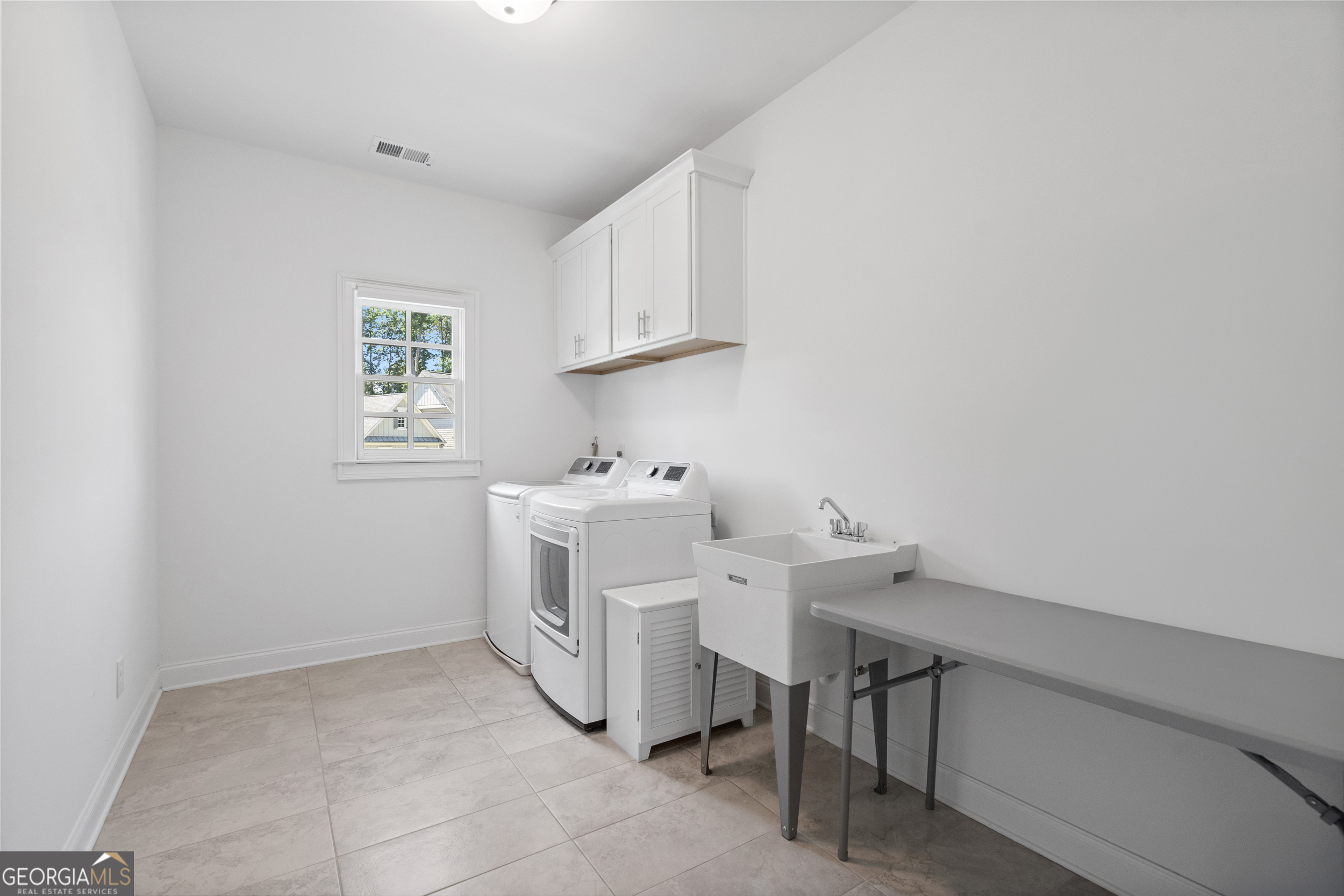 2045 Kent Court Milton, GA 30004 - Photo 71 of 104 a utility room with dryer and washer