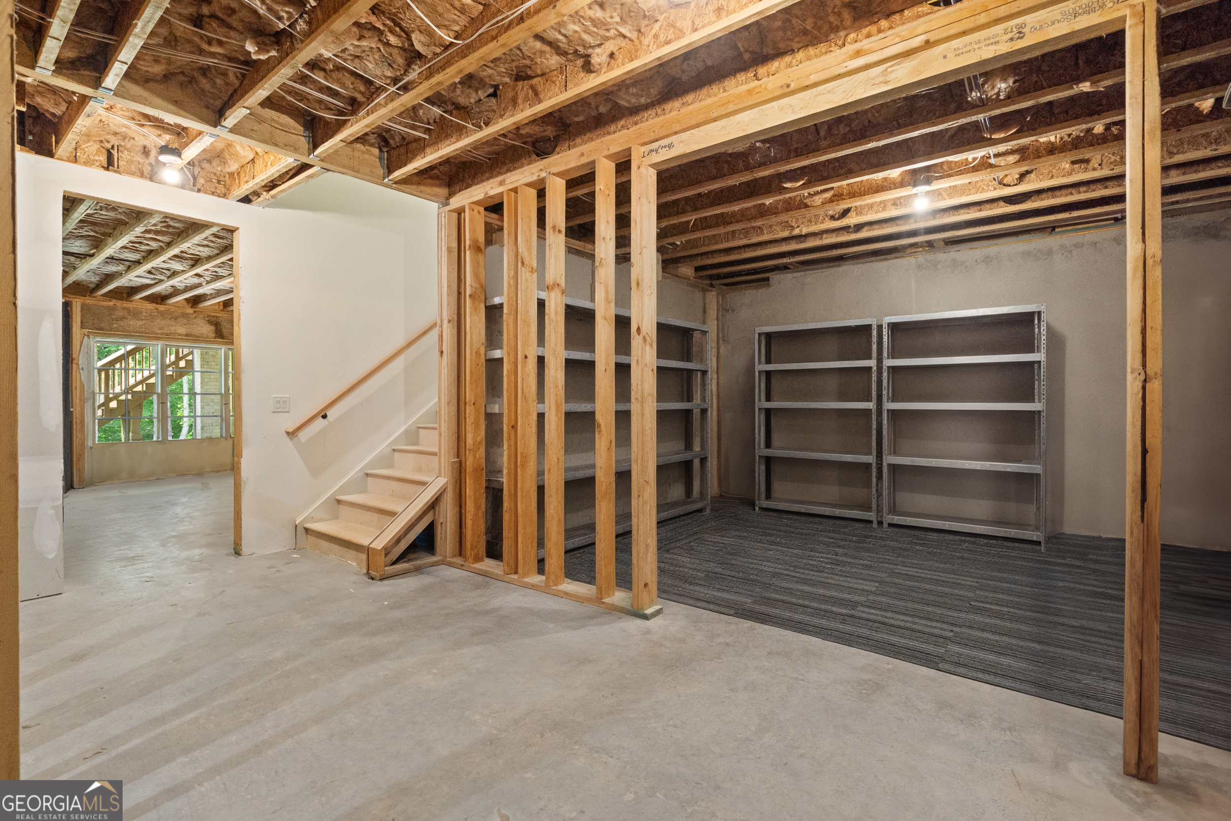 2045 Kent Court Milton, GA 30004 - Photo 75 of 104 a view of an empty room with a staircase