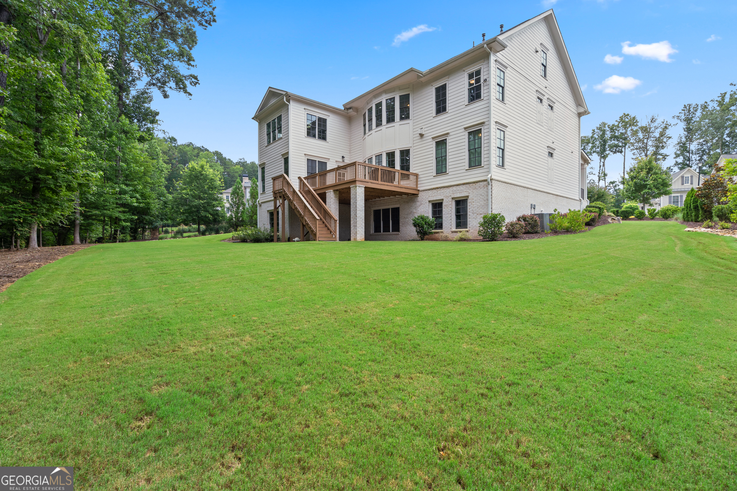 2045 Kent Court Milton, GA 30004 - Photo 76 of 104 a view of a big house with a big yard and large trees