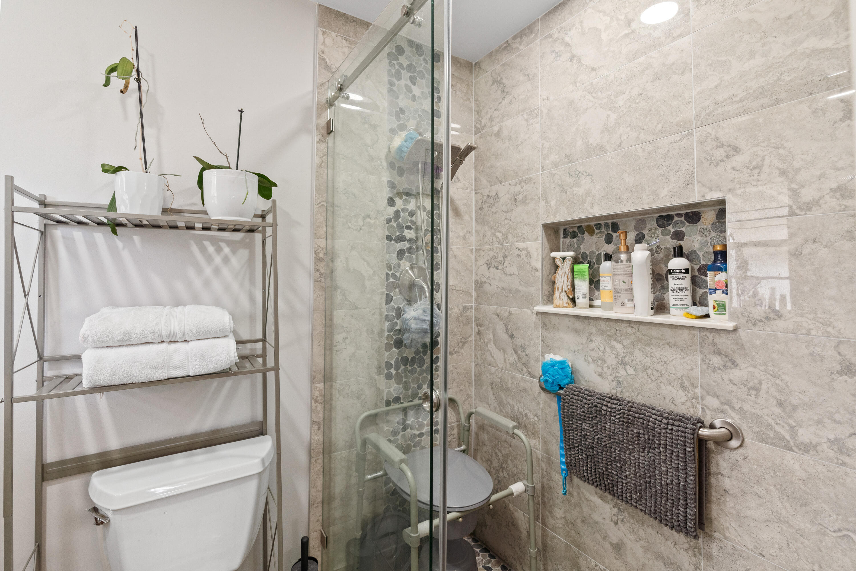 249 Cardinal Lane Delray Beach, FL 33445 - Photo 13 of 36 a bathroom with a shower a toilet and a sink