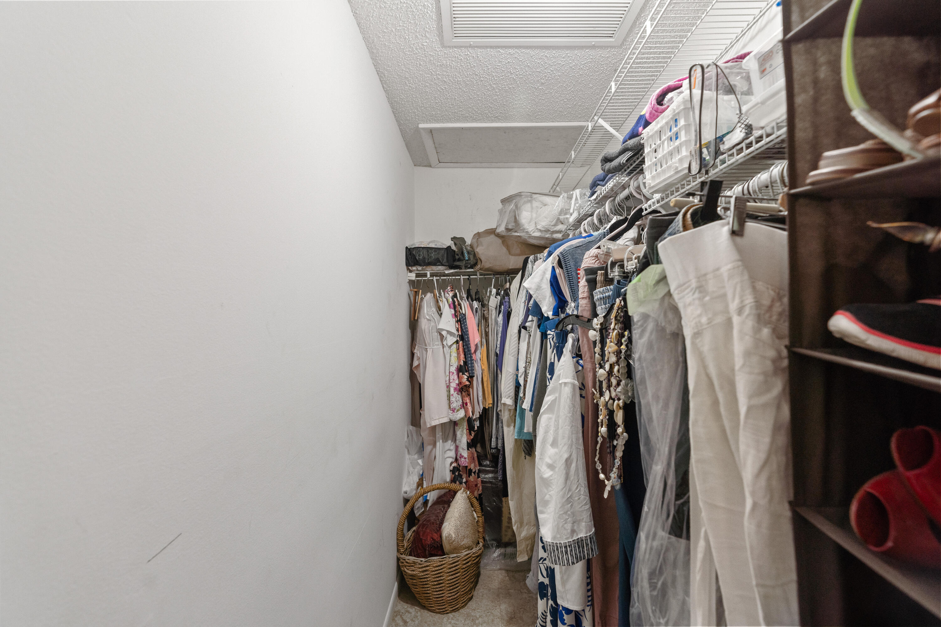 249 Cardinal Lane Delray Beach, FL 33445 - Photo 14 of 36 a view of walk in closet with clothes