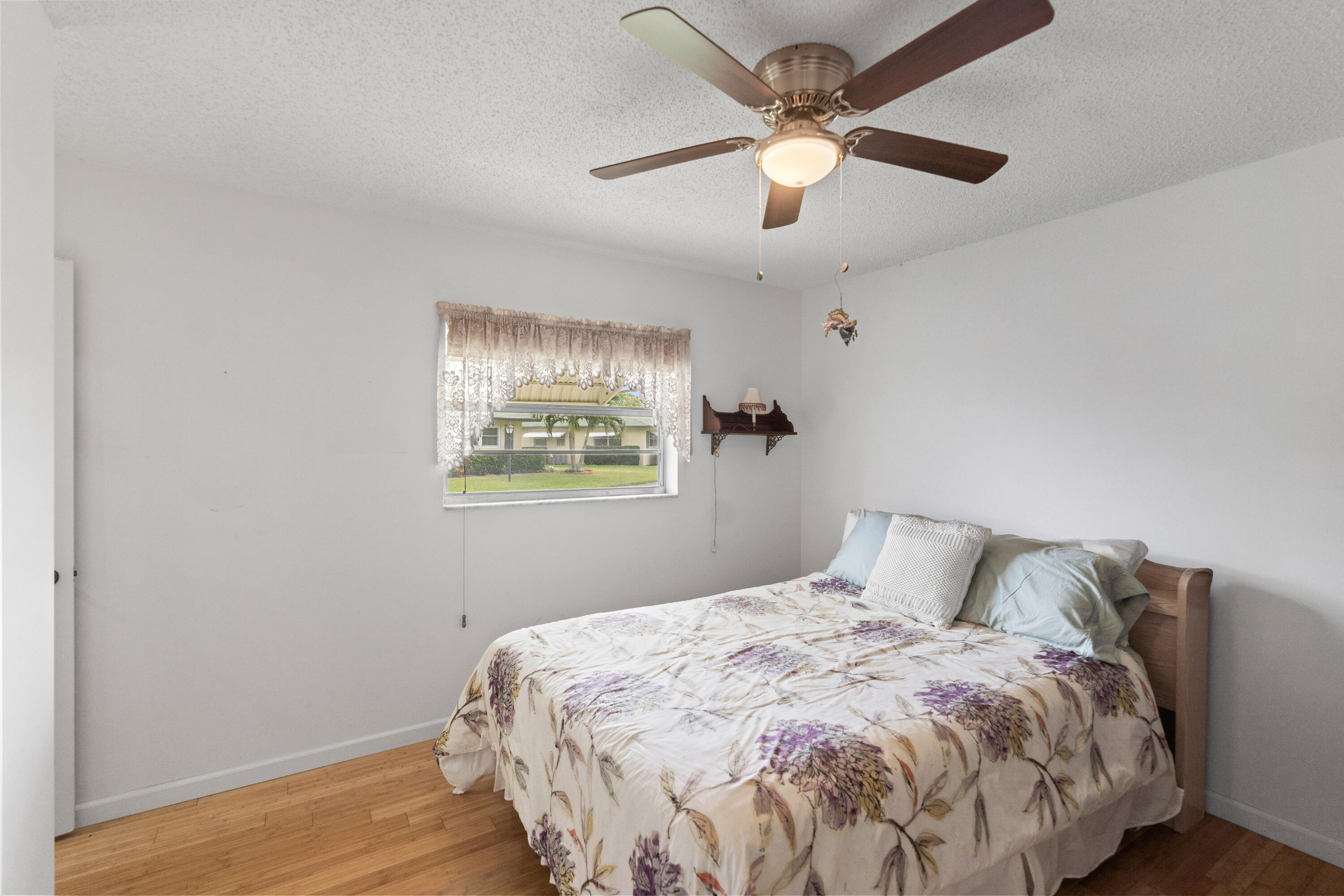 249 Cardinal Lane Delray Beach, FL 33445 - Photo 17 of 36 a bedroom with a bed and window