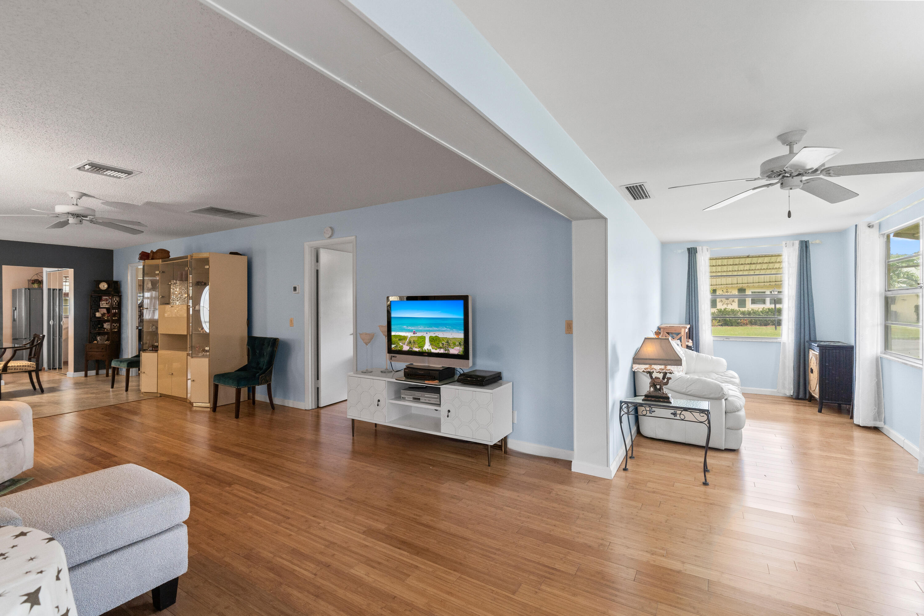 249 Cardinal Lane Delray Beach, FL 33445 - Photo 22 of 36 a view of a livingroom with furniture and wooden floor