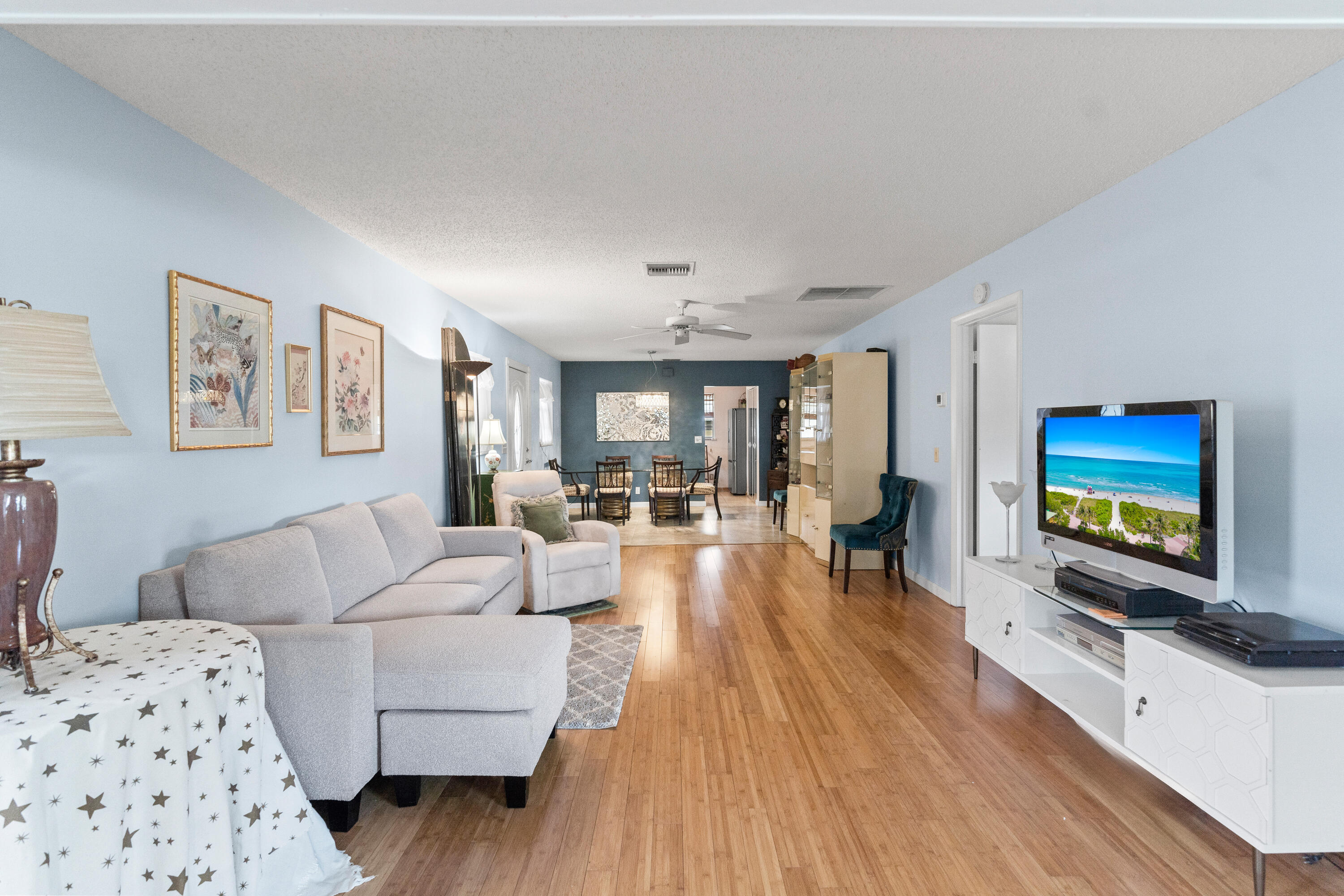 249 Cardinal Lane Delray Beach, FL 33445 - Photo 25 of 36 a living room with furniture and a flat screen tv