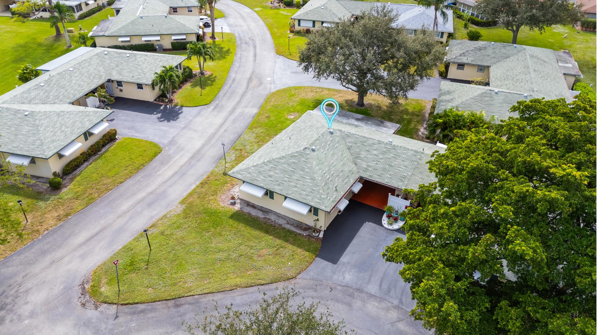 249 Cardinal Lane Delray Beach, FL 33445 - Photo 30 of 36 an aerial view of a house with swimming pool