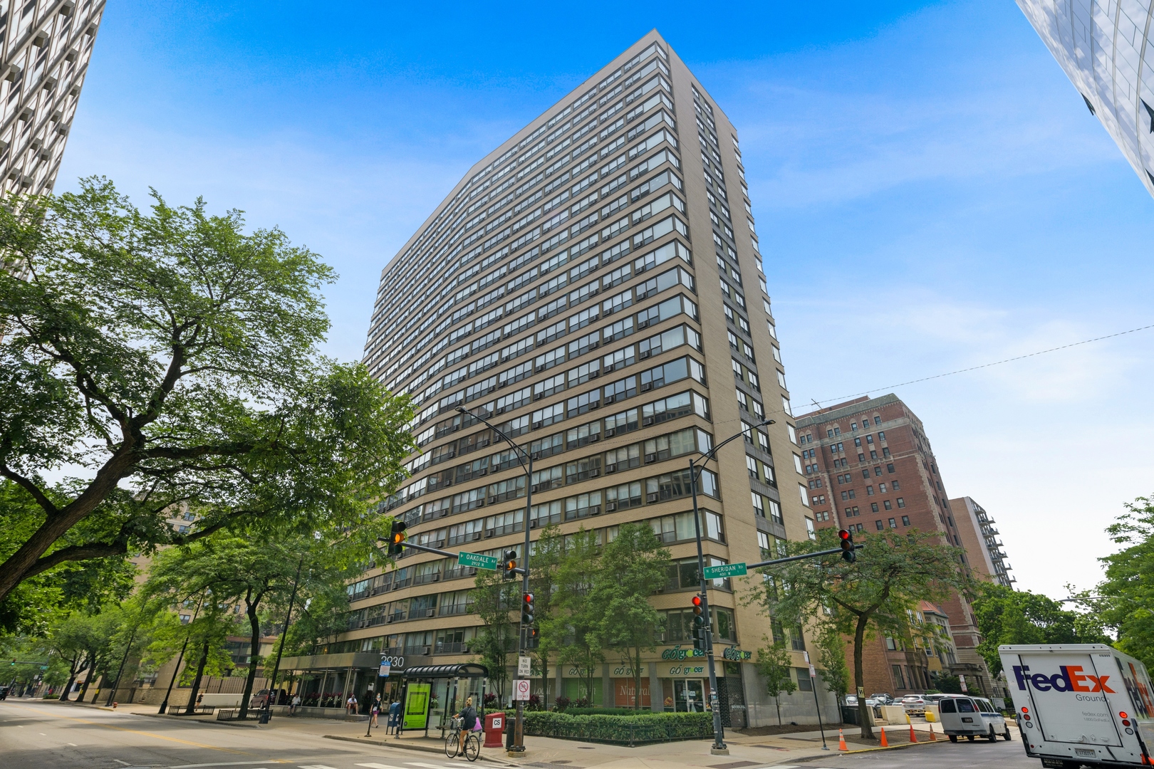 2930 North Sheridan Road, Unit 909 Chicago, IL 60657 - Photo 1 of 17 a view of a tall building next to a road