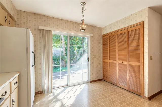 a view of a room with a large window