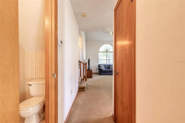 a en suite bathroom with a toilet sink and mirror