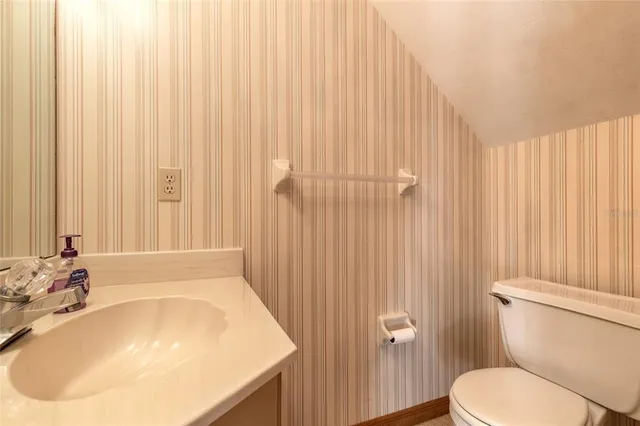 a bathroom with a sink a toilet and tub