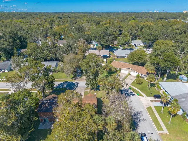 an aerial view of residential house with outdoor space